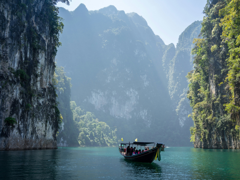 Longtail boats on the clear turquoise water of Phi Phi Islands, Thailand