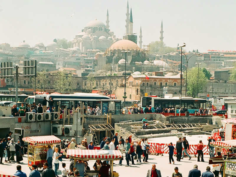 Blue Mosque in Istanbul, Turkey with tourists in front during sunset