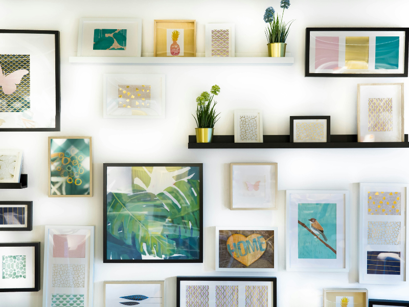Homemade abstract canvas art with bold brush strokes hanging on a wall