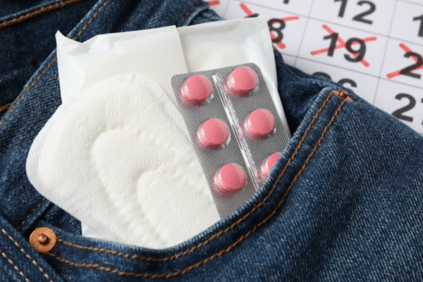 Woman wondering does stress delay menstruation while relaxing at home
